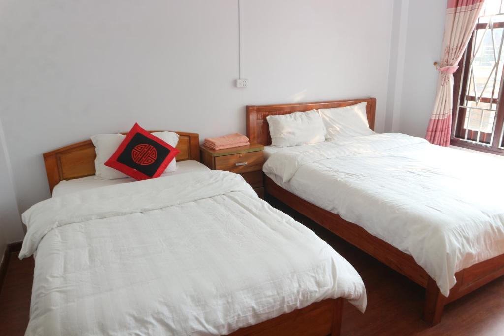 Postel nebo postele na pokoji v ubytování May Nui Sa Pa Hostel
