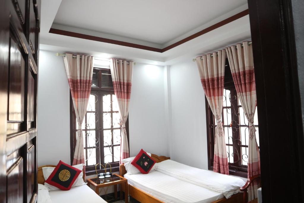 Postel nebo postele na pokoji v ubytování May Nui Sa Pa Hostel
