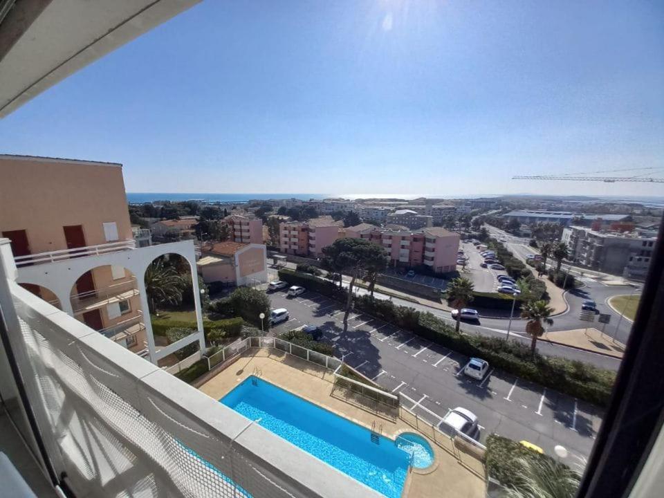 a view from the balcony of a apartment with a swimming pool at Le duplex panoramic sur Mer et Lido in Sète
