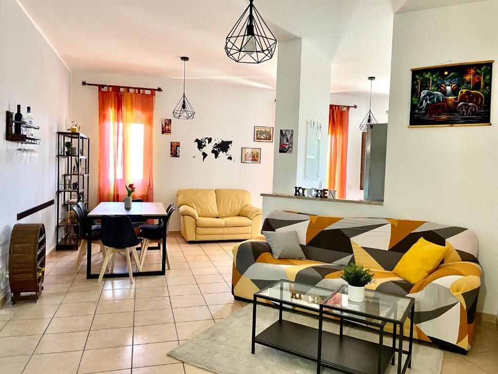 a living room with a couch and a table at La Corte del Principe in Bracciano