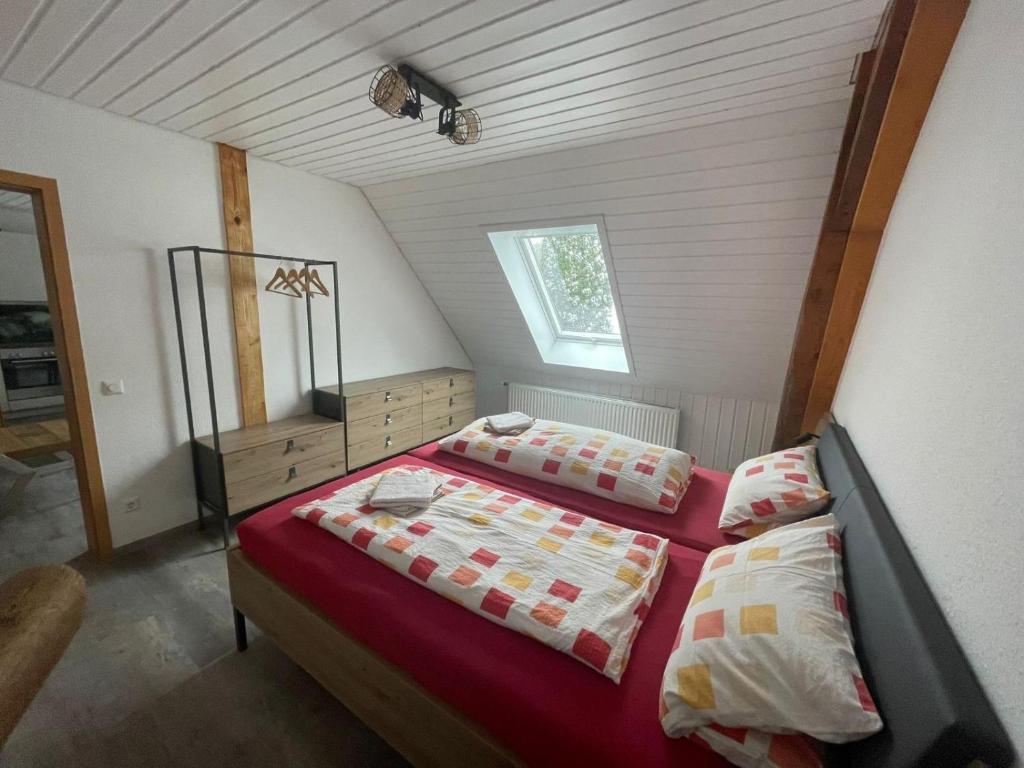 a bedroom with two beds and a window at Ferienhof-Gerda-Ferienwohnung-Sternenhimmel in Oberkirnach