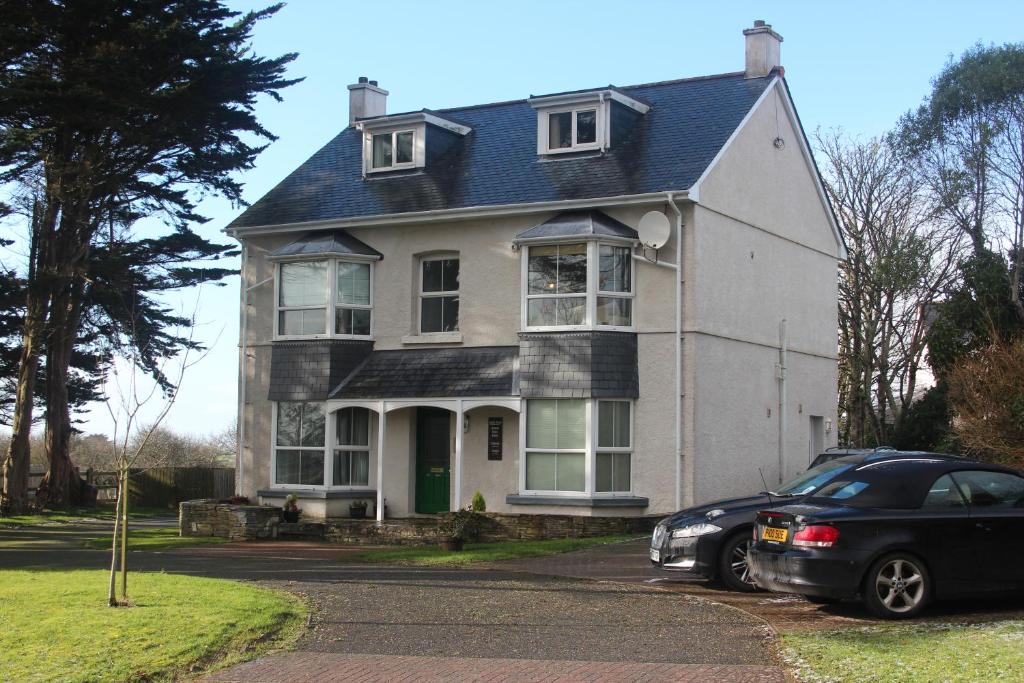 a house with a car parked in front of it at Bryher in Wadebridge