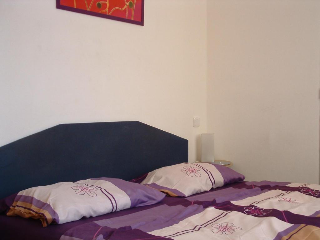 Postel nebo postele na pokoji v ubytování Nice Apartments Prague