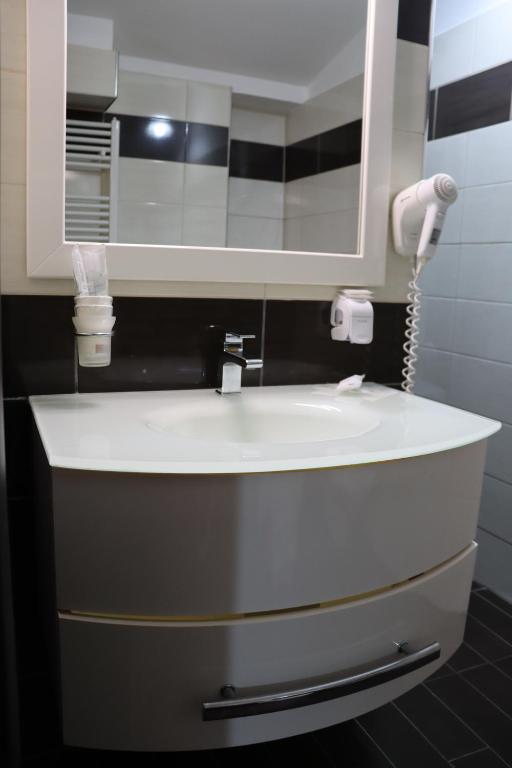 Koupelna v ubytování Hotel Paradiso