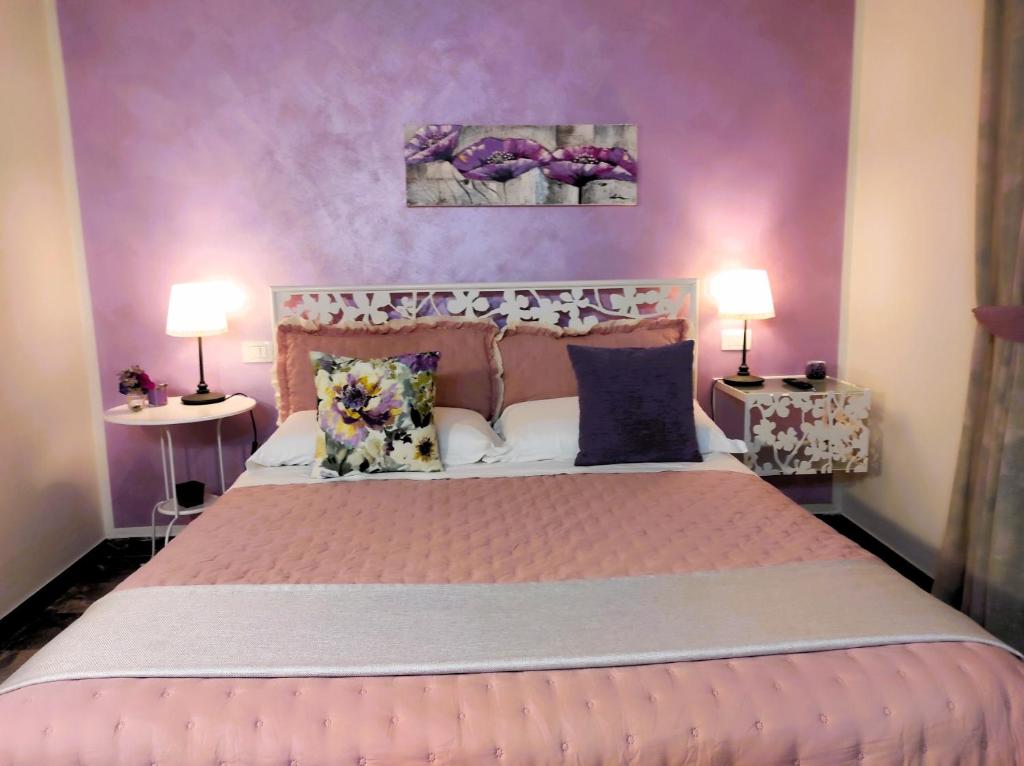 Postel nebo postele na pokoji v ubytování Affittacamere Casa Mac & Rose