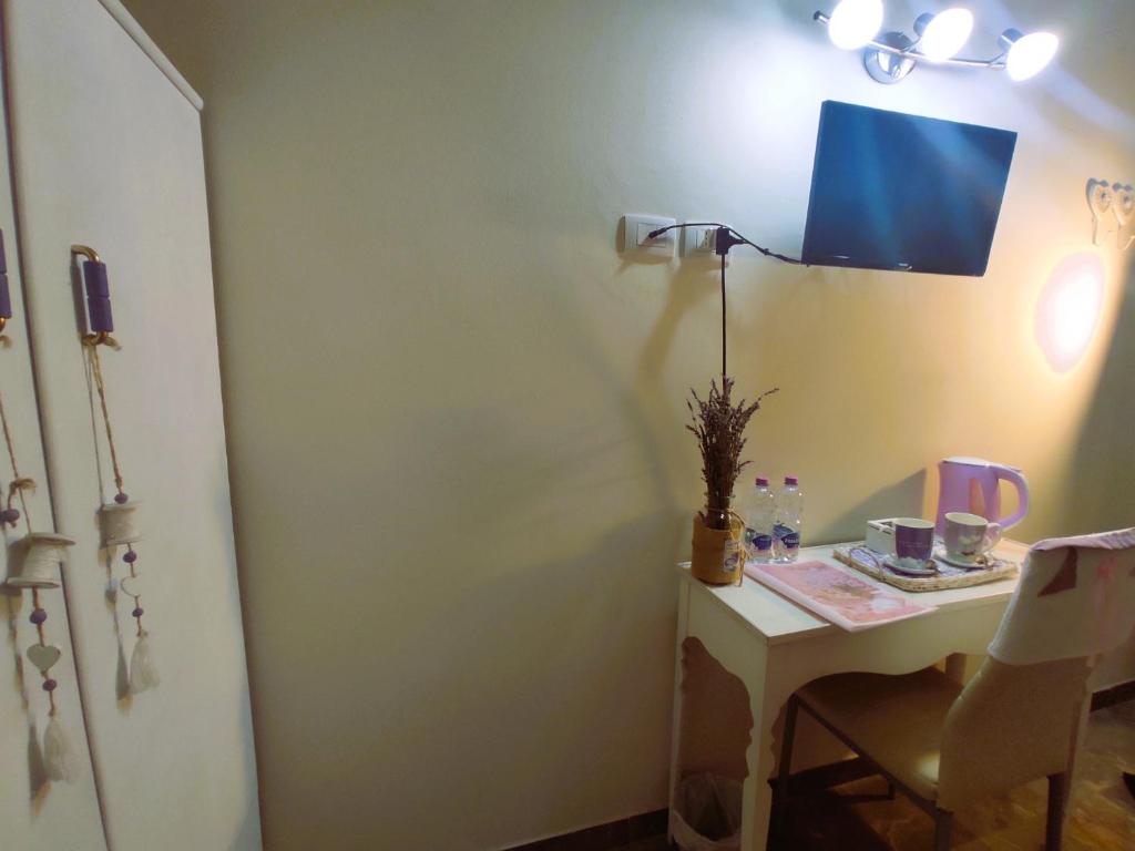 TV a/nebo společenská místnost v ubytování Affittacamere Casa Mac & Rose