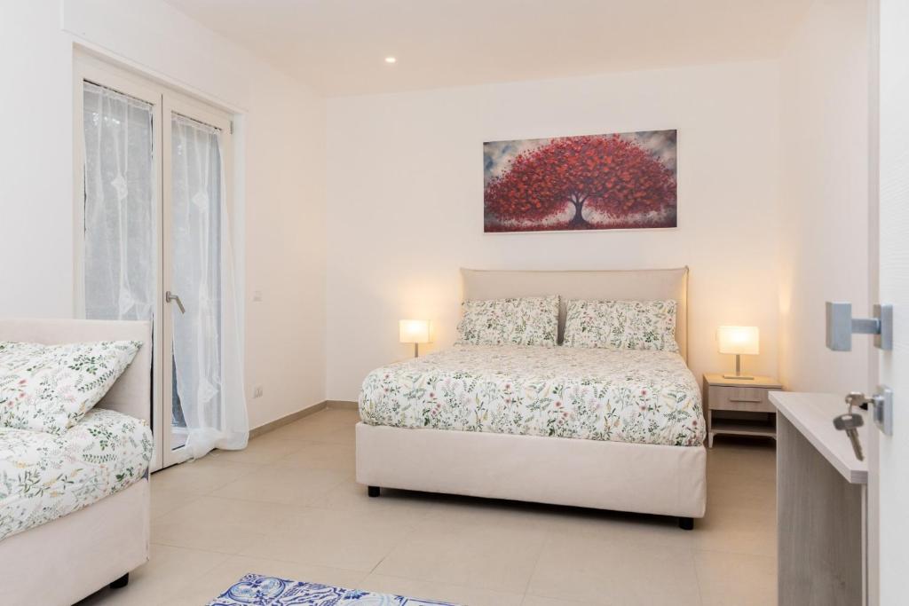 Postel nebo postele na pokoji v ubytování Villa Harmony Sorrento