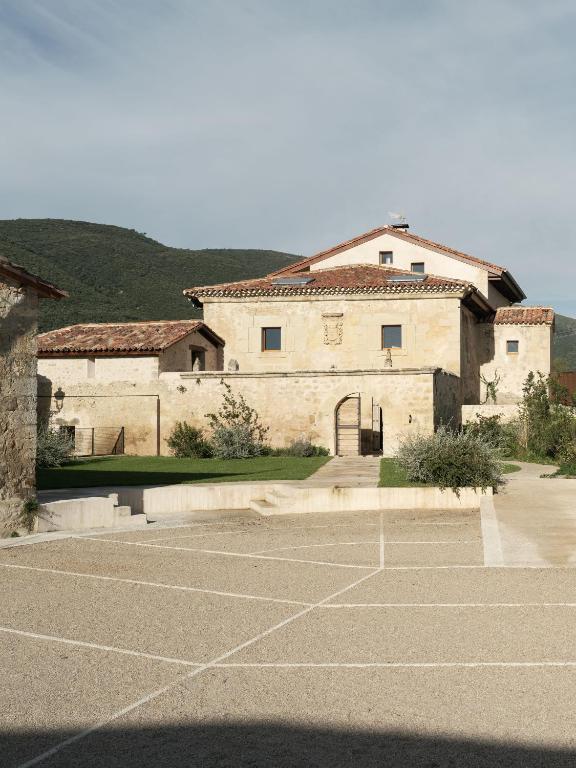 an empty parking lot in front of a building at El Priorato de Trespaderne in Trespaderne