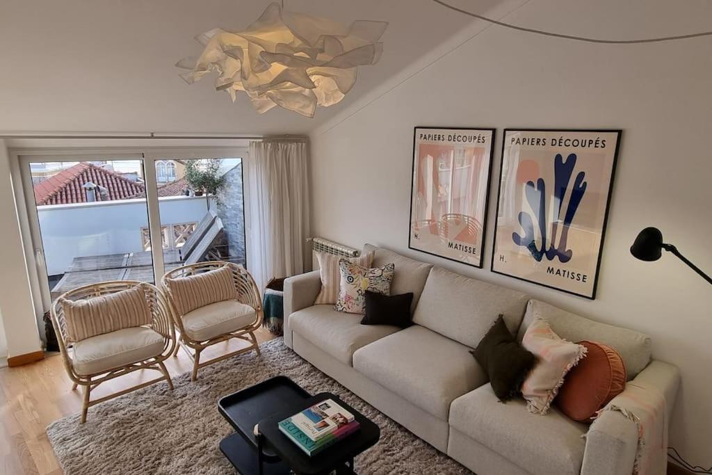 a living room with a couch and two chairs at Boutique Rooftop with Ocean views in São Martinho do Porto