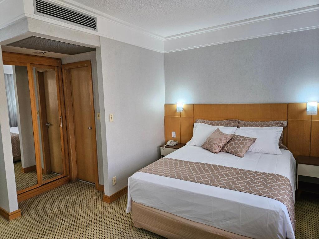 Postel nebo postele na pokoji v ubytování Flat Hotel Slaviero Guarulhos