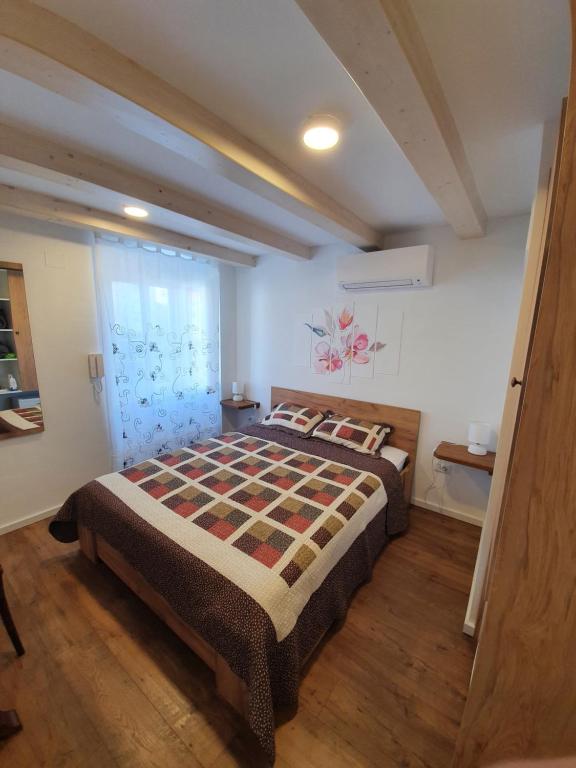 a bedroom with a large bed in a room at Room CS Cres in Cres