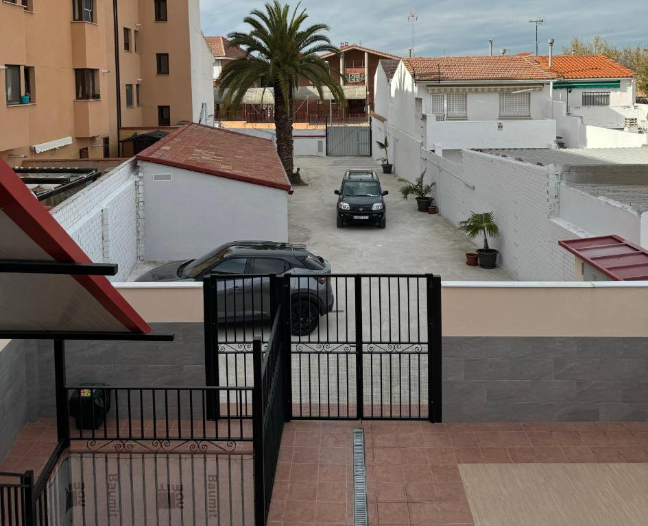 a car parked in a parking lot on a balcony at Apartamentos Jardines in Ciempozuelos