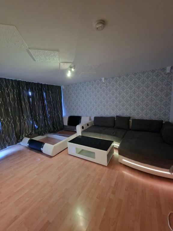 a living room with a couch and a bed at Apartment Darmstadt Mitte in Darmstadt