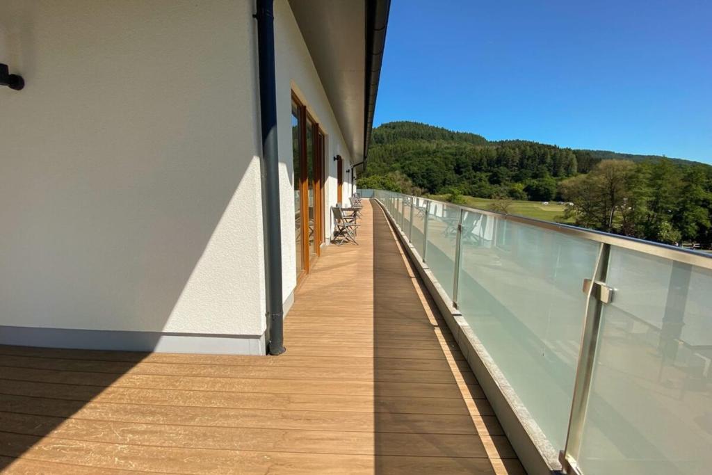 a balcony of a building with a view of the mountains at 310 Lux Furnished flat in Beaufort