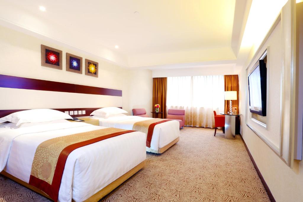 Postel nebo postele na pokoji v ubytování Casa Real Hotel