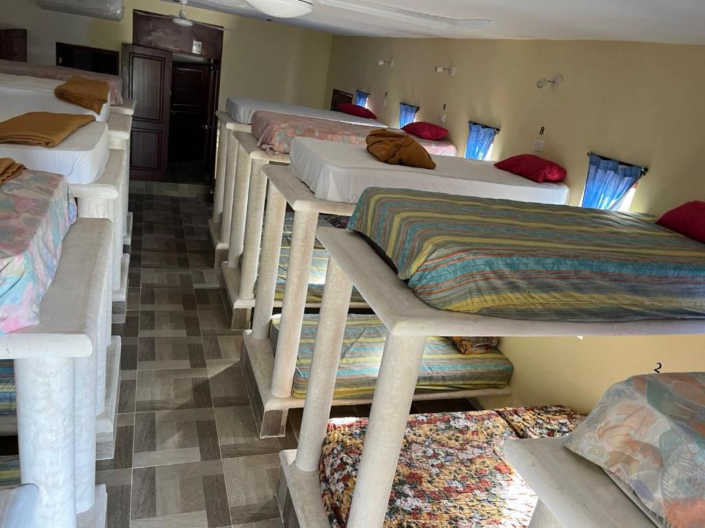 Ένα ή περισσότερα κρεβάτια σε δωμάτιο στο hostal nojoch-che