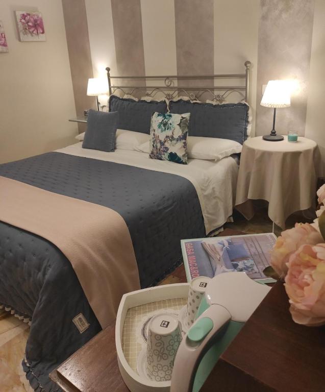 Postel nebo postele na pokoji v ubytování Affittacamere Casa Mac & Rose