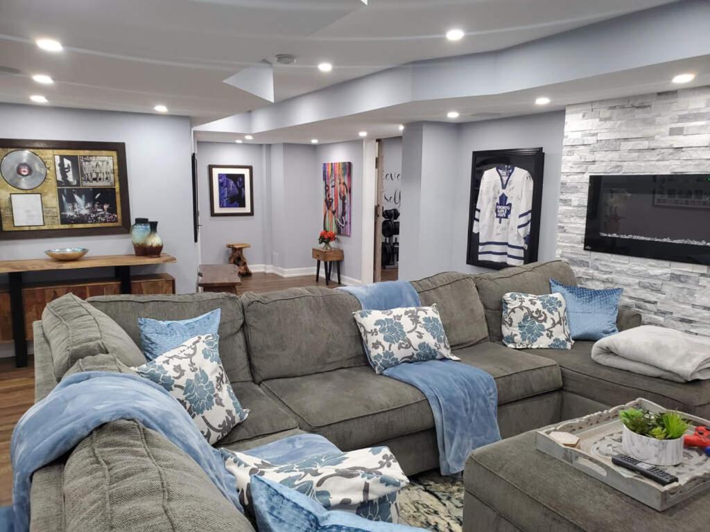 a living room with a couch and a tv at Brown Villa in Edmonton