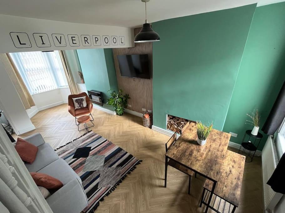 a living room with a couch and a table at Entire house in Liverpool in Litherland
