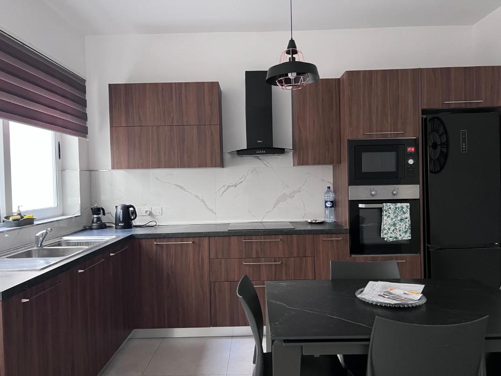 Kuchyň nebo kuchyňský kout v ubytování Zenia Court