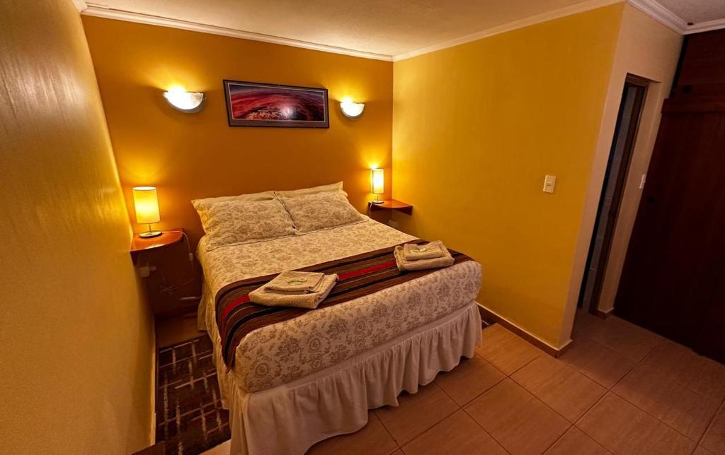 Postel nebo postele na pokoji v ubytování Hostal Solor