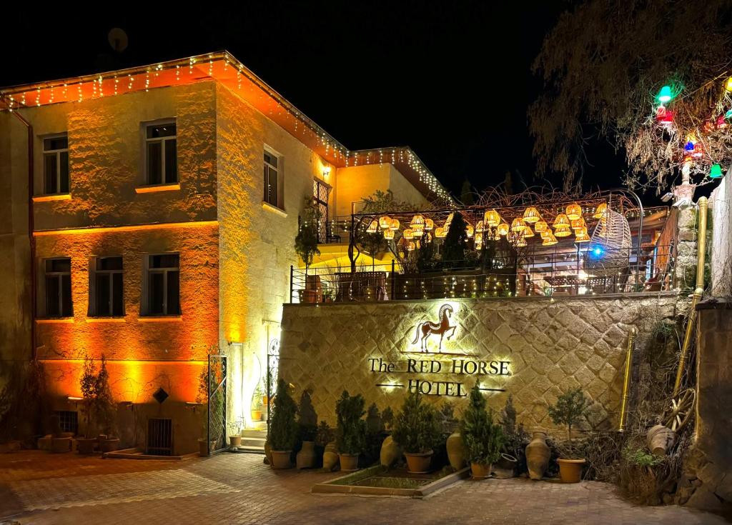 a building with a sign that reads the red house hotel at THE RED HORSE HOTEL in Ürgüp