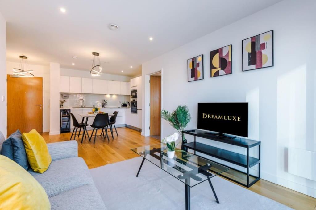 a living room with a couch and a table at Windmill Suite- Modern 2 bed 2 bath with concierge perfect for leisure, business and contractor stays by Dreamluxe in Birmingham