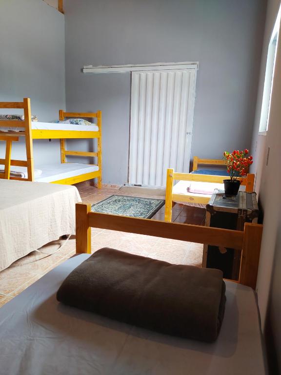 Postel nebo postele na pokoji v ubytování Hostel do Cerrado
