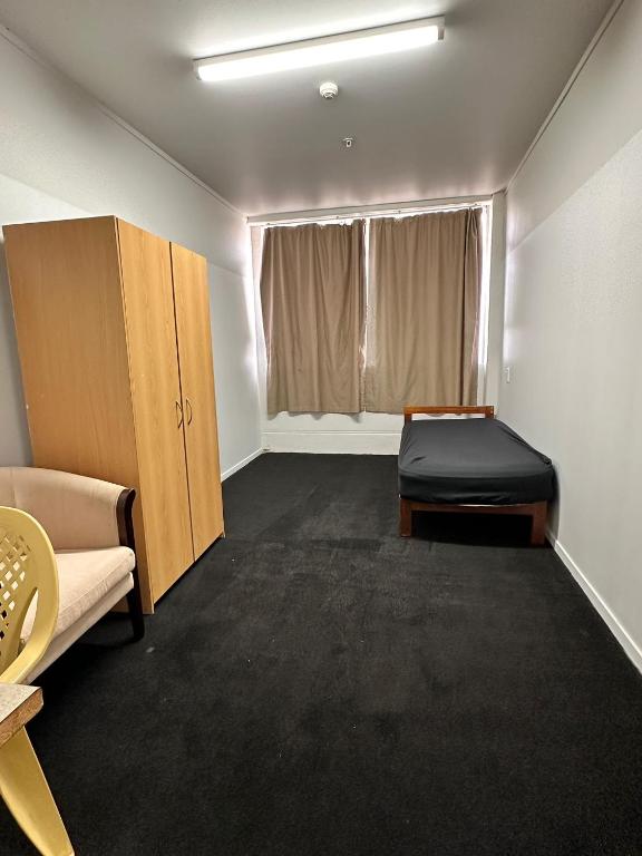 Postel nebo postele na pokoji v ubytování Hamilton City Inn