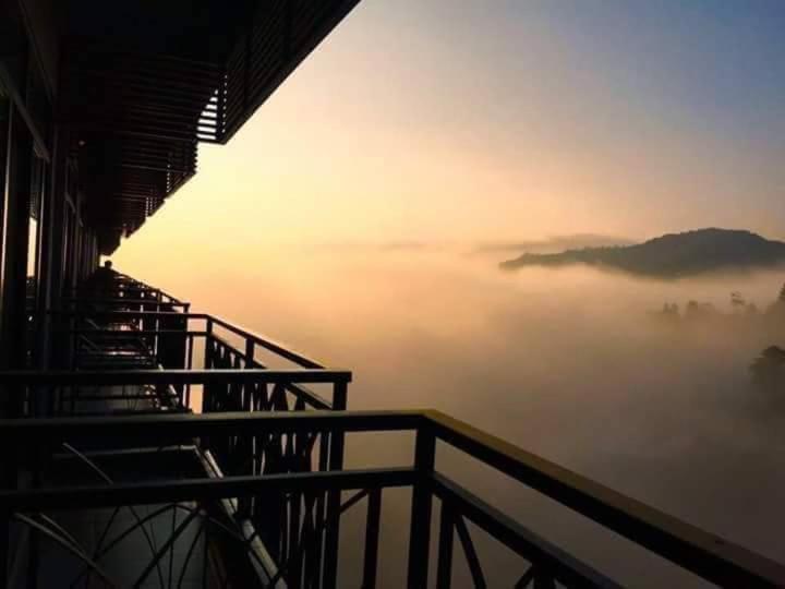 a view from a balcony of a foggyominiumasteryasteryasteryasteryasteryastery at Cthomestay @ nova highland hotel in Brinchang