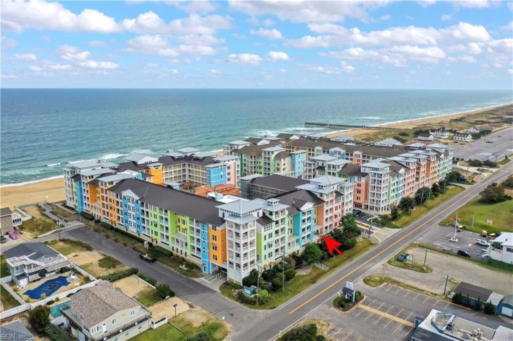 an aerial view of an apartment complex next to the ocean at Island Breeze 120A in Virginia Beach