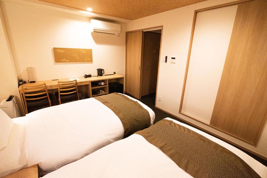 Postel nebo postele na pokoji v ubytování Xcellent Hotel