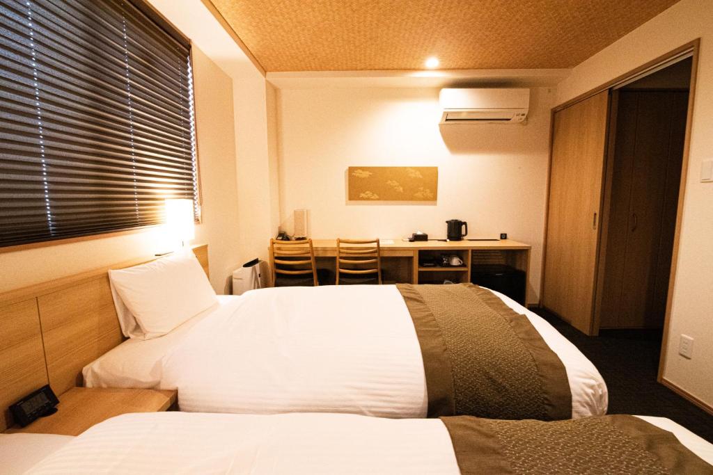 Postel nebo postele na pokoji v ubytování Xcellent Hotel