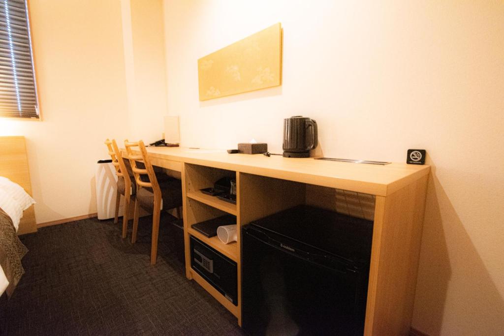 Postel nebo postele na pokoji v ubytování Xcellent Hotel