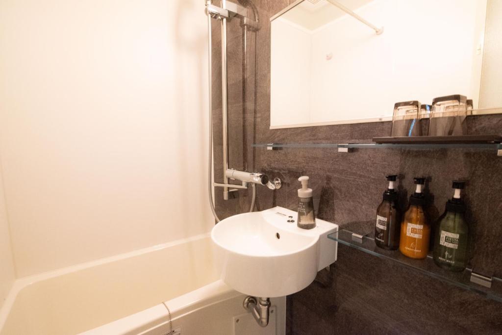 Koupelna v ubytování Xcellent Hotel