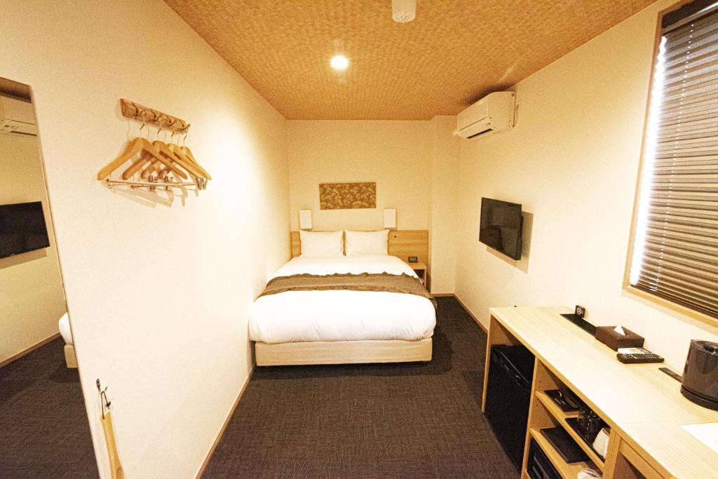 Postel nebo postele na pokoji v ubytování Xcellent Hotel