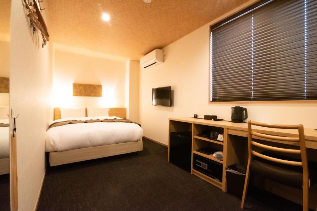 Postel nebo postele na pokoji v ubytování Xcellent Hotel