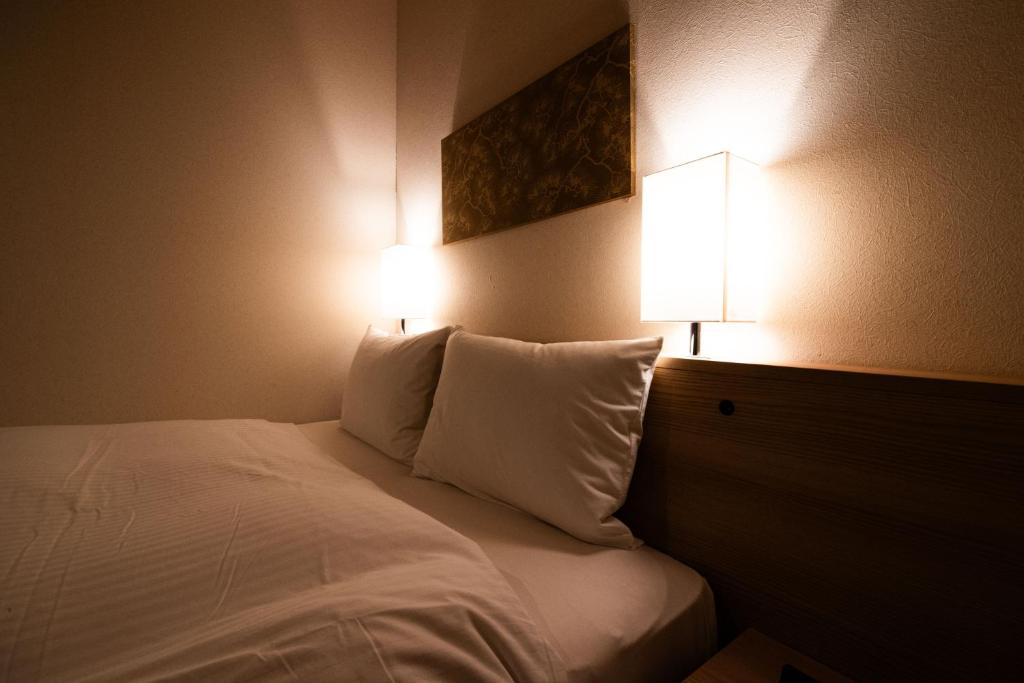 Postel nebo postele na pokoji v ubytování Xcellent Hotel
