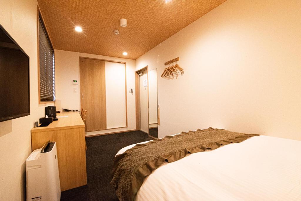 Postel nebo postele na pokoji v ubytování Xcellent Hotel