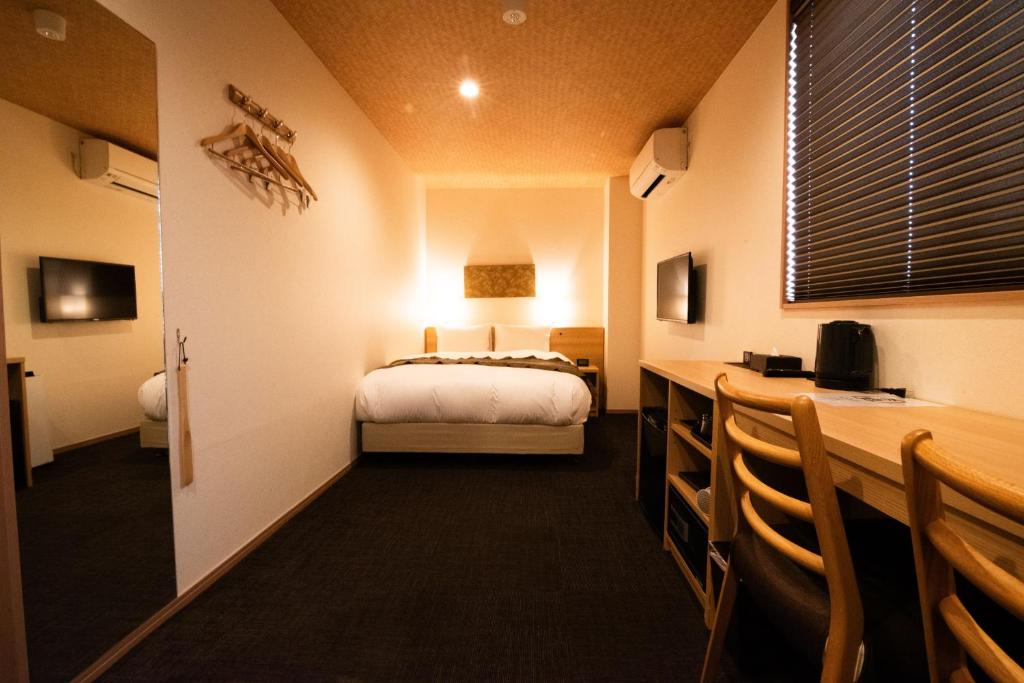Postel nebo postele na pokoji v ubytování Xcellent Hotel