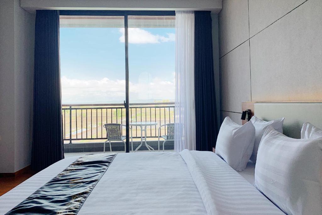 Postel nebo postele na pokoji v ubytování Grand Miami Hotel