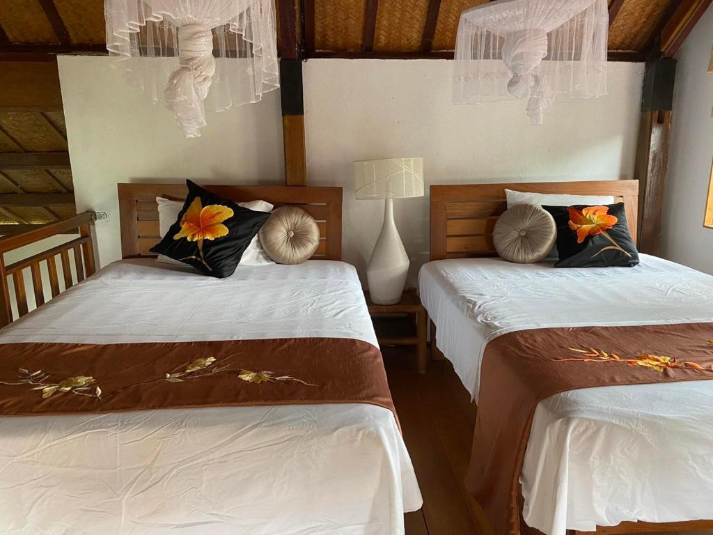 Postel nebo postele na pokoji v ubytování An Bang Seaside Village