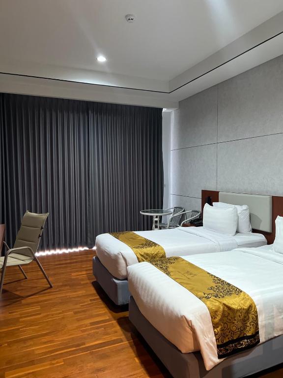 Postel nebo postele na pokoji v ubytování Grand Miami Hotel