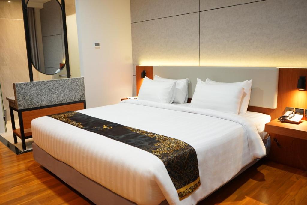 Postel nebo postele na pokoji v ubytování Grand Miami Hotel