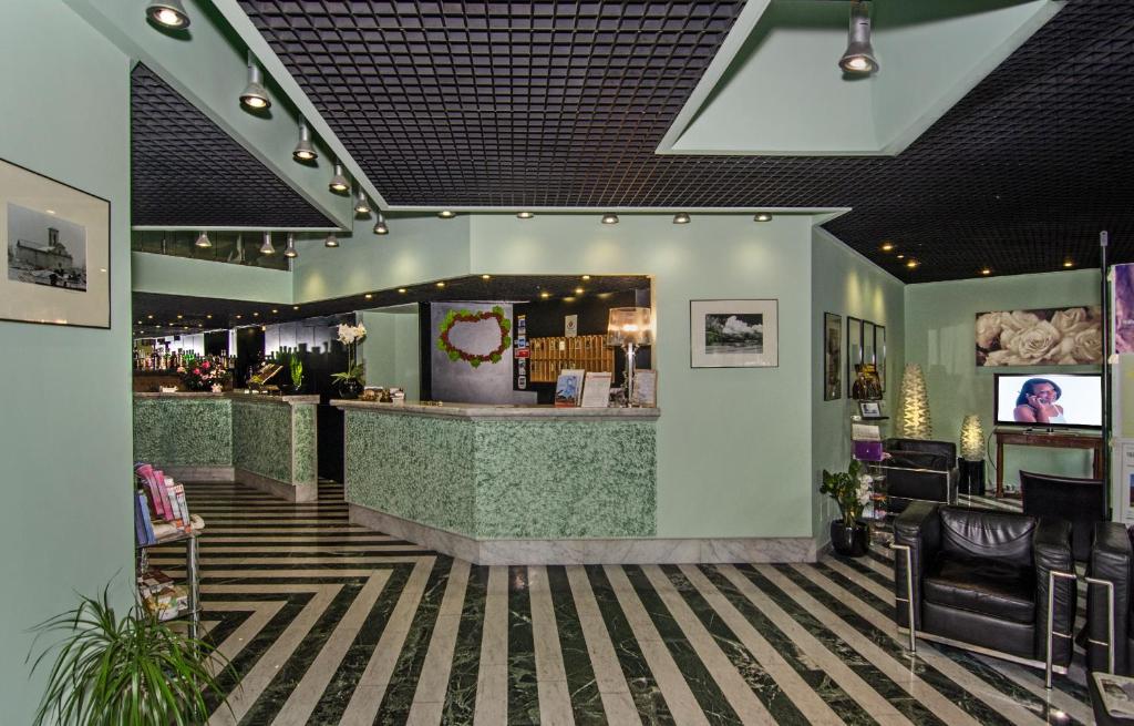 TV a/nebo společenská místnost v ubytování Hotel Rex