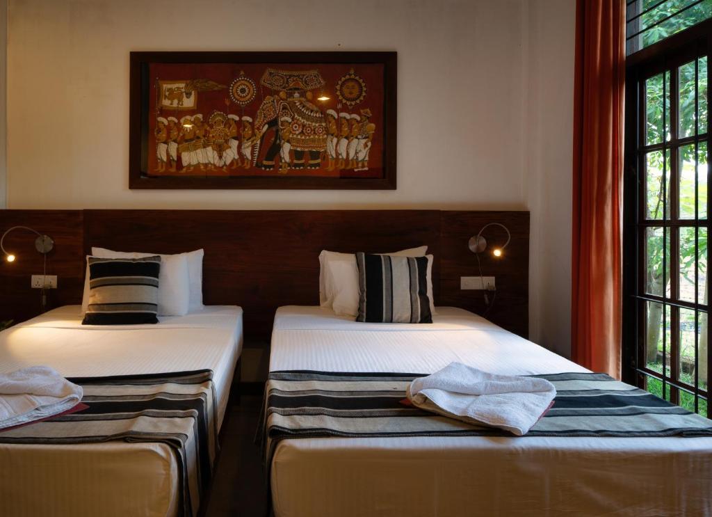 Postel nebo postele na pokoji v ubytování Lario Resort Sigiriya