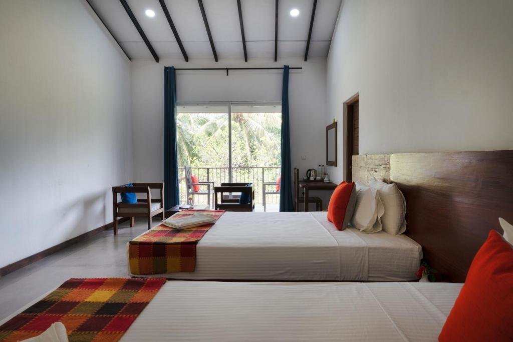 Postel nebo postele na pokoji v ubytování Lario Resort Sigiriya
