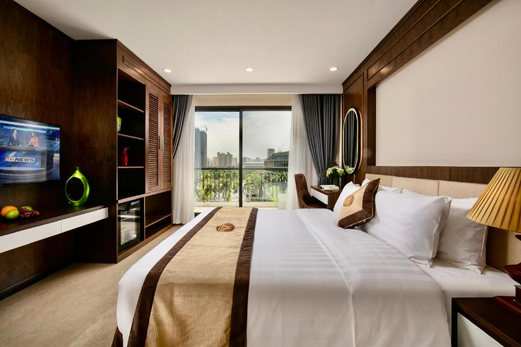 a bedroom with a large bed and a large window at Marina Hotel Ha Noi in Hanoi