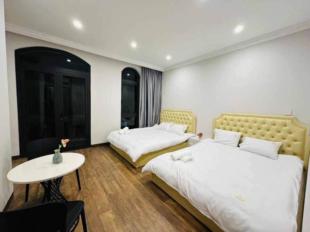 Кровать или кровати в номере Lavender Villa Homestay Ocean Park 2