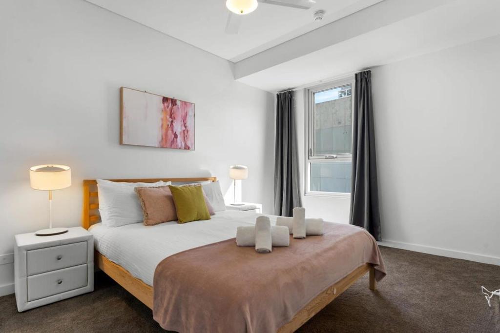 Ένα ή περισσότερα κρεβάτια σε δωμάτιο στο 1BR Adelaide CBD Apt The Best Location